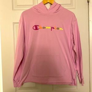 A pink Champion hoodie